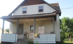 1950's Old House for Sale 55,000. Large yard 2 lots, a garage, a basement for storage or make into another room, a porch, 2 bathrooms, laundry room, kitchen, dining, living room, guess room on the mid-level and the top level has the 4bedrooms. phone #