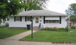 What a neat home this is and located only 1/2 block from the public school. This home features 3 spacious bedrooms, full bath with shower, large living room and a large kitchen with birch cabinetry. The lower level is unfinished and has great potential