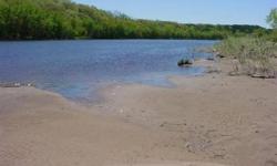 This picture perfect building site is on a dead end street and directly on the Wisconsin River! Just a stones throw from Lake Delton and Baraboo, seclusion is the best. Whether you are a naturalist who likes to kayak and canoe, or the avid fisherman, this