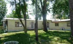 This mobile home and addition is on nicely treed lot in Savage. It's only a 1 bedroom, but there is a finished addition between mobile and 2 stall garage that could be make into extra living area. Furnished and ready to move into.Listing originally posted