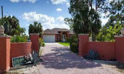 Beautiful custom built 2009 4 Bedroom home on 4.5 Acres! Centrally located between Marco Island and Downtown Naples. Very private property with lush landscaping and mature fruit trees. Features a full guest suite with it's own kitchen and bath. Granite