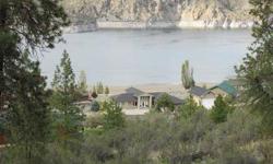 Wake up to "another day in Paradise on Lake Roosevelt". That's what the Hanson Harbor homeowners are saying and you could too! Enjoy breathtaking 180 degree mountain and lake views from your great room window wall of glass or on your glass framed 800 SF