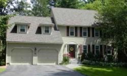 Charming 4 bedroom, 3 1/2 bath colonial nicely tucked away in a quiet upscale wooded neighborhood. This lovely home has just under 4,000 square feet including 3 full floors of living space, a large private deck and 2 car attached garage. The delightful