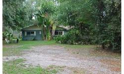 Beautiful property with gorgeous trees with excellent "close in location" minutes from Veterans Expressway & Carrollwood shopping. This property has frontage on Little Half Moon Lake picturesque-- House is old and in poor condition and is sold " as is"