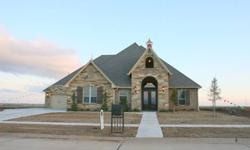One of Lawtons finest homes, The Grand Bellissimo is a true work of art. An open floor plan offers almost 3400 square feet of living on one level. From the sidewalk a beautiful mix of stone and brick pulls you towards the grand vaulted entry and though