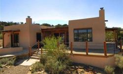 80 acres with a nicely built in 2002, family home. Totally off the grid with 2 straw-bale guest casitas and 1 shop/studio. Main home is 1540 sq ft, pueblo revival style with finishes including vigas, lentils,kiva fireplaces,radiant heat, 2 bedroom, 2.5