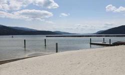 130 feet of deeded primier white sandy beach fronting on Mosquito Bay at the North end of Priest Lake near the Thorofare. Flat , level lot bordering on water on 2 sides both Priest Lake and the Sandpiper Canal. Property is just north of the Thorofare.