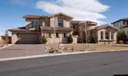 Mediterranean style home showcases a inviting entry and delightful courtyard located on the golfcourse in ArrowCreek. Beautifully designed with spacious formal living and dining, den plus a great room,and office with built ins. The gourmet kitchen is