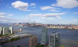 Luxurious penthouse apartment in Trump Towers designed for the connoisseur of finer lifestyles. Relax in this distinctive home with sensational and inspiring sunrise and sunset views of the NYC skyline from your terrace. The kitchen offers cherry