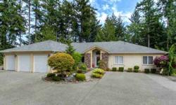 Stunning 3 Bedroom Rambler in Canterwood! Home has been meticulously maintained w/upgrades everywhere you look from the NW landscaping to the Japanese Cherry hardwood floors, slate entry & extra wide hall/doorways. Each bedroom has its own private