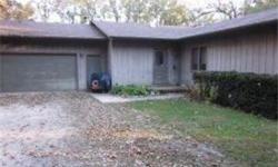 Beautiful wooded 5+ acre with a 1/2 acre pond. As you enter the secluded winding driveway there are many varieties of oaks and native plants. Home to quiet seclusion! Plant a garden, enjoy the wildlife all at this beautiful home. Sun shines through the