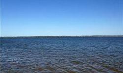 This is a very rare find on Lake Conroe! .99 of an acre with pretty waterview from the right and an amazing, breathtaking eastern waterfront view looking across the lake to open water. It is unrestricted but sits inside of Diamondhead community. The size