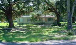Pretty 2 acre corner lot with a 3/2 DW mobile home rented out month to month for $550 and a 2 bedroom 1 bath singlewide that has the potential for $350 per month. (Owner is currently working to bring the wiring up to code on the signlewide). Convenient to