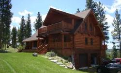 Incredible views and privacy galore are yours from this custom built log home on 40 acres. The epitome of Montana Living, this home boasts granite, travertine, marble and other high-end finishings, maple flooring and a gourmet kitchen. Loft overlooking