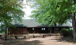 Log home on 87.235 acres with magnificent views of 3 counties offers bonus seating for annual fireworks displays! Secured pipe entry gate, excellent gravel road & many mowed interior trails make this property ideal for recreational use