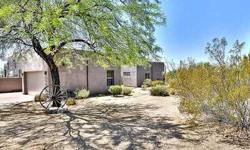 Custom Santa Fe style home on a very private 1.59 acre lot.Lush desert landscape w/many Saguaros.Spectacular sunsets,360mtn & city light views from the view deck. Lots of windows provide natural light. All main living areas & master suite features access