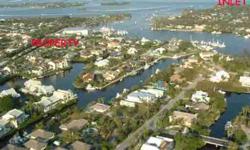 PRICE SLASHED!!!! LOOKING FOR SHELTERED DOCKAGE MINUTES FROM THE ST. LUCIE INLET WITH A SEPARATE GUEST APARTMENT ALL FOR UNDER $1,000,000. IT'S HARD TO FIND. HERE IS YOUR OPPORTUNITY! 3/2/2 MAIN HOME WITH AN ATTACHED 1/1 GUEST APARTMENT. PRIVATE DOCK WITH