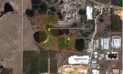 Florida Land for sale 117 Acres Available. This Lake Front property (outlined in red) Currently zoned Agricultural for low tax purposes, this property is surrounded by industrial properties! This property is a great development site, and has very high