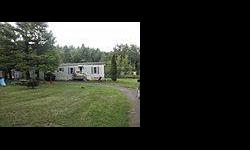 2 bedroom manufactured home with a great country setting just a short hop to the Stamford golf course and the village of Stamford..house is set nicely back from the road with large shade trees and all level land...new replacement windows , small rear