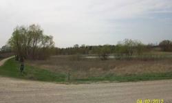 Approximately 11 acres of land about five miles SE of Faribault, MN. Borders gravel road and corner of asphalt road, with a nice pond. A nice acreage to pasture or to build on.