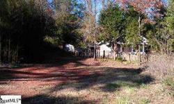 Bank Owned!! House with 1.02 acre lot on Old Buncombe Road near the intersection of Old Buncombe and Hwy 253. Property is currenty zoned residential but would be a good candidate for possible rezoning. Sold as is. Seller has never occupied property. It