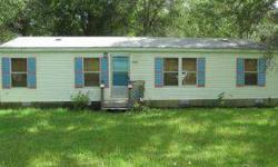 ADORABLE 3/2 MOBILE ON 6.46 ACRES. PARTIALLY CLEARED, PRIVATE SETTING. QUICK CLOSING. HOME HAS ONLY BEEN USED AS A WEEKEND RETREAT.
