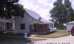 Nice small town setting home with 3 bdrms and 2 car detached garage. Sits on two lots w/fenced in back yard.Listing originally posted at http