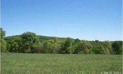 Gorgeous land with seasonal views of the brushy mountains. 6 acres surveyed from larger parcel. Great horsback riding country with short ride to Love Valley and Super Trails. Gently sloping land planted in fescue and fenced on 3 sides. Small stream in the
