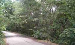 Lovely lot surrounded by Beautiful homes, across from Highlands Golf Course. Lot is on a small circle that affords privacy, but is easily accessible to the proposed by-pass, and Hiwassee Rd that goes right to HWY 72 into Bentonville. Lot has a park like