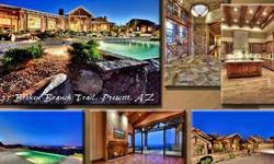THE CROWN JEWEL OF PRESCOTT, THIS SPECTACULAR 3.2 ACRE LUXURY ESTATE is located in the gated golf community of Hassayampa Village. This dramatic single level rustic retreat captures breathtaking views from nearly every room and patio while maintaining