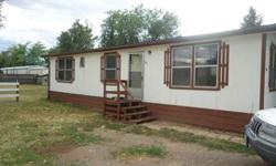 3 bedroom, 2 bath, manufactured home in Lochbuie. Chain-link fenced and gated lot of 6700 square feet. Plenty of off-street parking with room for a garage. Buy for less than rent! Was rented at $800 per month. Conventional or cash. May go FHA. Seller will