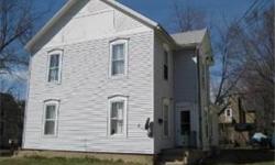 Two Flat with Great Potential, with Lower and Upper Units. Separate Entrances and Utilities for each unit. West Side Location. Great Opportunity to Begin Your Investment Portfolio. Close to Town, Schools, Library, and Shopping. Back Porches on Both Units.