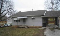 This cute little home has been remodeled with a new bathroom and utility room in the basement. There is a carport and a garage/storage building. The home and garage sit on 2 lots. It is close to the school and only five minutes to the lake. It would be