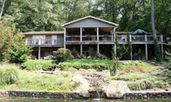 This beautiful waterfront home is situated on 1.2 +/- level acres with 450 +/- feet of water frontage and has exceptional outdoor living areas with access to the oversized decking from the dining area, great room and master suite. Paula McDaniel has this