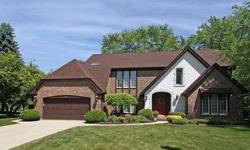 FABULOUS EXECUTIVE HOME ON A BEAUTIFULLY LANDSCAPED LOT! This stunning Tudor has amazing details