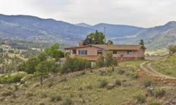Beautiful ranch style home on 40 acres with incredible views in foothills adjacent to Spring Gulch Estates. Refinished original wood floors, fireplaces on both levels, upgraded appliances. Basement includes walk-out solarium/rec room. Red rock cliffs