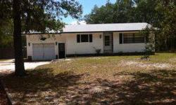 Don't miss out on another great deal! This home is ideally located between Lecanto and Homosassa. Home is situated on 1.5 acres of beautiful country land, lots of privacy. Home features over 1200 square feet of living area with 2 possibly 3 bedrooms, 1