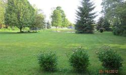 Beautiful park like acreage ! Small pond on grounds. Awesome hill to place your home on or build closer to the pond -- you choose. New 10 x 12 shed on this 6.25 acres of property. Property is located within the city limits, but you feel like you're in the
