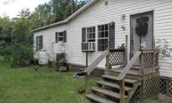 A very nice and large, 3 bed/2baths doublewide in a peaceful country setting on 2.18 acres. Large greatroom, huge eat-in kitchen with counter bar, inside laundry room, walk-in closets and fireplace. Very large deck with plenty of sitting area and with