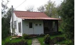 GREAT COUNTRY GET AWAY IN SCENIC RURAL SETTING! COMFORTABLE COTTAGE W/VAULTED CEILING AND CRAWL SLEEPING LOFT. K/LR FORM AN L SHAPED OPEN SPACE. ENCLOSED & OPEN FRONT PORCHES. COVERED DECK OFF KITCHEN. WALK OUT FULL BASEMENT. 2 CAR GARAGE W/WOODSTOVE AND