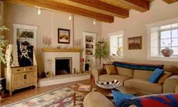 Pied a Terre with the utmost in Santa Fe Style is just two blocks from the Historic Plaza! Built by Sharon Woods in 1984 this wonderful residence in the beautiful Magdalena Compound has an elegant yet very comfortable feeling. Extra thick adobe walls,