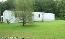 Very nice well maintained 3BR/2BA 14'x76' Manufactured Home on 2-Acres in NW Jax Dinsmore area. Open and spacious living area with split Master BR plan. Dining area with extra cabinets and countertops. Includes Refrigerator, Range, Washer & Dryer. Inside