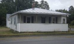 Own for less than you can rent! Cute property w/nice yard within short walk to park,lake,restaurants,shopping & recreational trails. Lg. outbuilding will hold all your tools or toys. Just a bit of TLC will make this one shine. New windows, metal roof,
