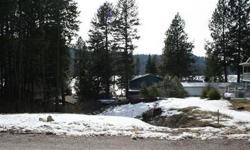 Rare Wanakiwin Association lake view lot. This is one of the last lots available in this area and it is ready to go! All utilities are available at the property line, building plans, permits and engineering details are all county approved. Park your boat