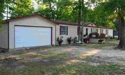 You will love this 4 bedroom, 2 bathroom manufactured home in 1 acre! Home looks like new! New paint (inside and outside), new carpet, new vinyl floors, new A/C, new water heater! This house is ready for a new owner! You will love the gigantic master