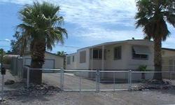 Location, location, near the Bullhead City Community Park and public boat launch to Colorado River. Close up view of the Laughlin, NV casinos. On a cul-de-sac, this singlewide mobile home is extremely clean and ready to move in, includes a detached garage