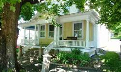 This quaint semi-Victorian style home is graced by beautiful porch w/columns, lattice, spindled rails & relaxing porch swing. Home is accented w/beautiful natural woodwork thru-out incl columns & french doors. Kit w/handmade cabs, ironing cupboard &