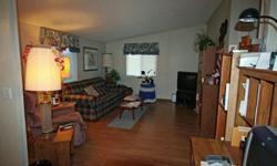 Affordable, spacious, well-kept 3bdrm, 2ba double-wide manufactured home located in Gold Beach Mobile Home Park. Close to shopping and the beach.Home has beautiful laminate floors throughout, open floor pan. Space rent is $289 per month, which includes