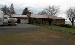 Beautiful remodeled split-level home on 80 acres. Over 3200 sf of living space with new kitchen, master bath and roof. 3 wheel lines, two spring fed ponds, dbl car garage, shop, barn and hay shed. Hard to find 80 acre parcel, irrigated in Umatilla Co.