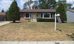 Three bedroom home in Carpentersville with two full baths. Bi level layout gives a few options for living arrangements. The main level has a living room and the kitchen. Three bedrooms on the upper floor, each with a private closet. Two car detached